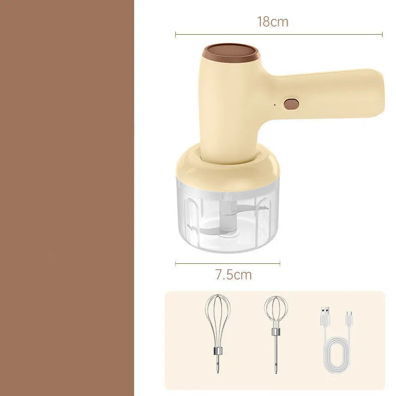 Beige electric garlic chopper with USB charging cable, 250ml cup, and stainless steel blade on kitchen counter