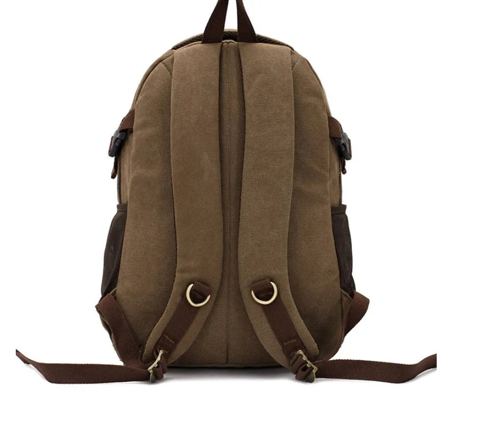 Canvas computer backpack in black with square vertical shape, zip closure, and multiple pockets