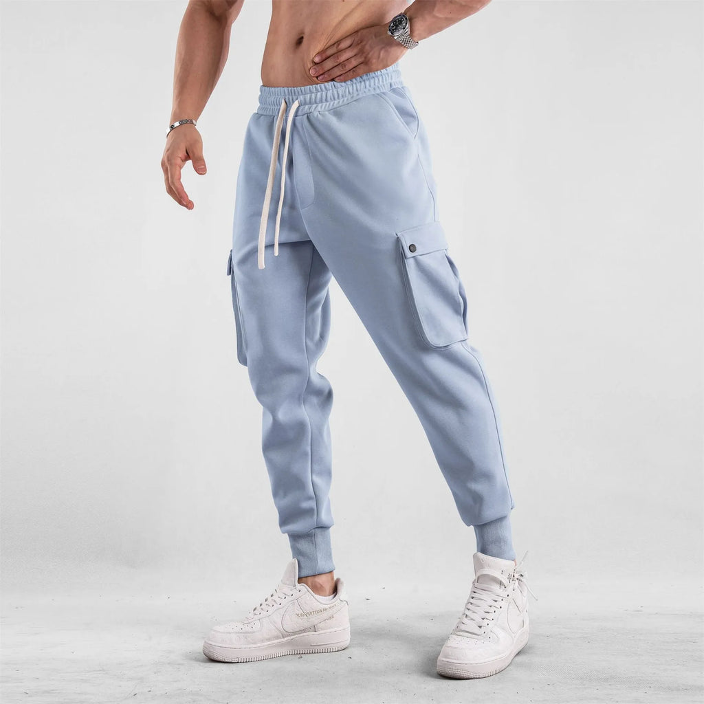 Men's loose cotton sports trousers with ankle ties and multiple pockets in various colours