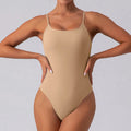 Women's slim sleeveless yoga jumpsuit in tight fit with triangular cut design