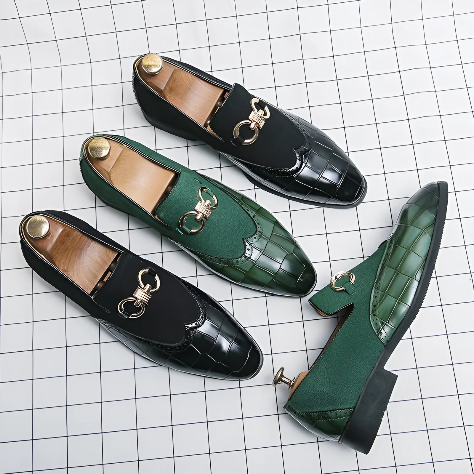 Men's black pointed toe low top casual shoes with a rubber sole and decorative stitching.