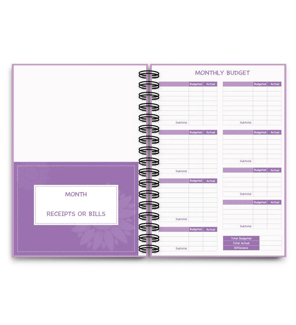 Purple coil-bound budget notebook with financial planning stickers and paper clips for monthly money management