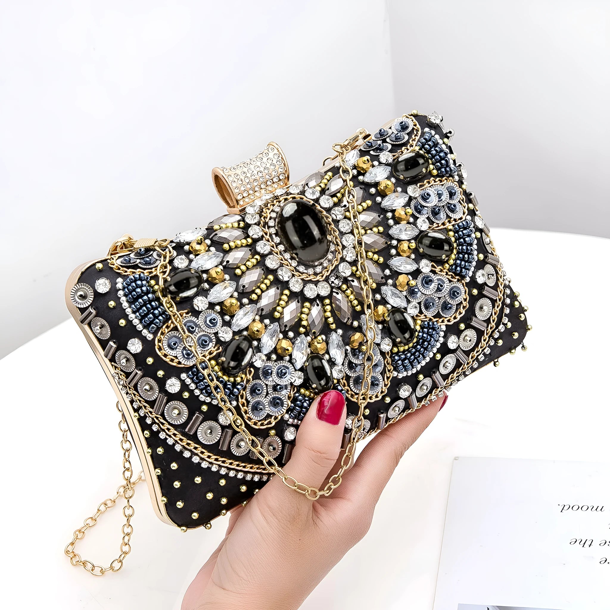 Retro hard shell dinner bag with pearl embroidery and beading in white, showing three-dimensional pocket and hand-held design