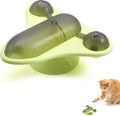 Blue interactive pet puzzle toy with a spinner, snack cabin, bell, and suction cup base on a floor.