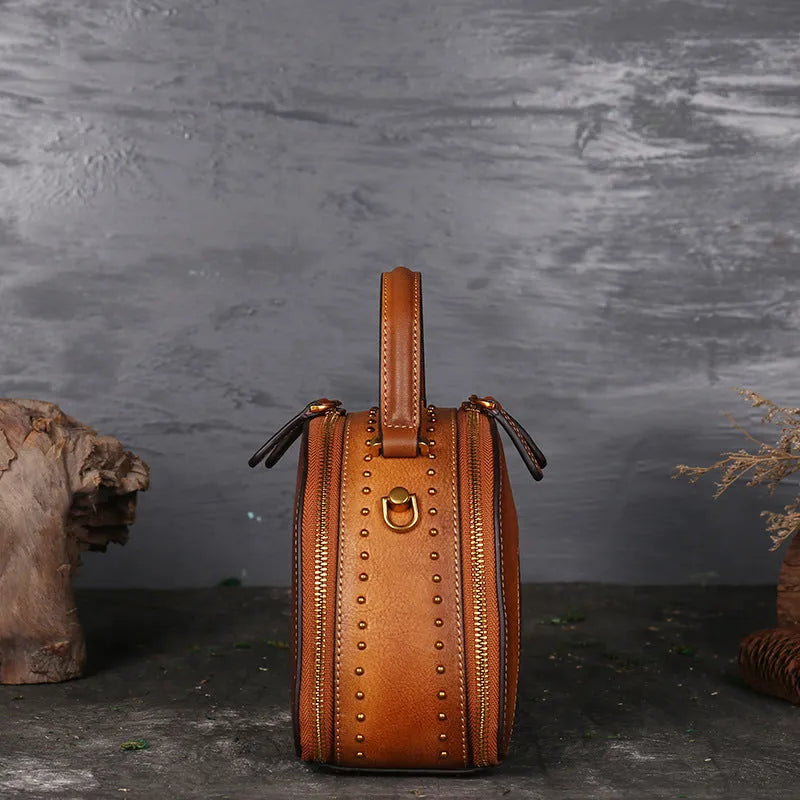 Vintage suede cowhide leather handbag showing internal ID pocket, phone pocket, and zipper compartments.