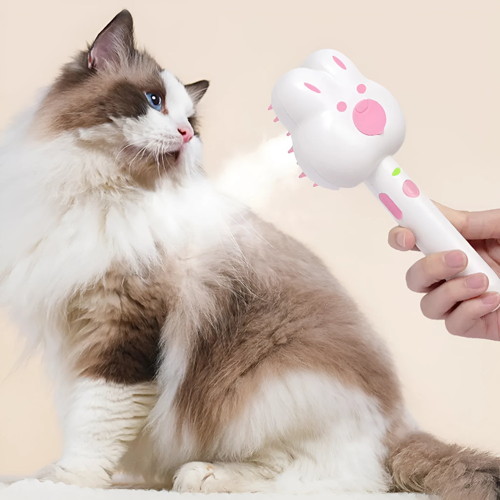 Rechargeable cat steam grooming brush with long handle and rounded brush end in choice of colours