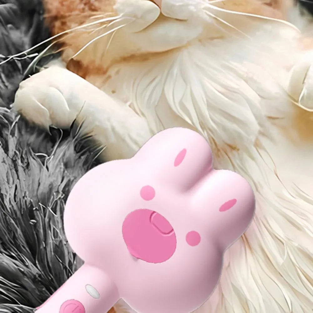Rechargeable cat steam grooming brush with long handle and rounded brush end in choice of colours