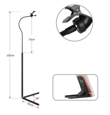 Black bedside mobile phone holder mounted on a bed frame with a phone securely clipped in place.