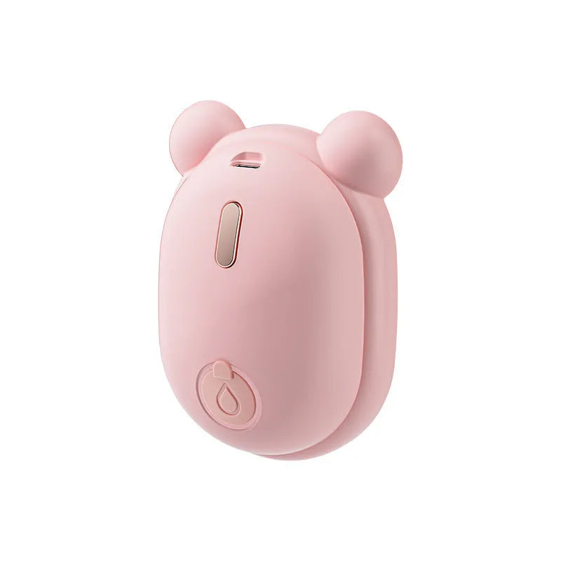 Pink and yellow rechargeable pet grooming brush with spray bottle, soft rubber teeth, and a removable silicone comb.
