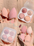 Makeup egg box showing four coloured synthetic sponge applicators: Grape, Mango, Mint, and Peach Peach.