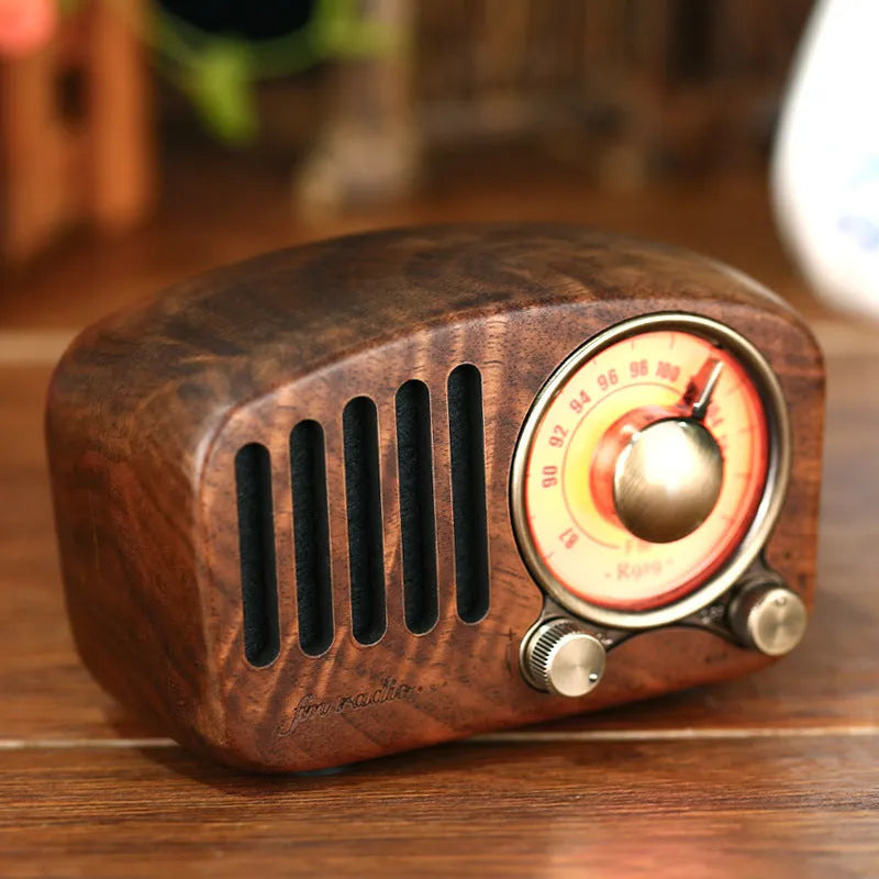 Retro style wooden mini wireless Bluetooth speaker in cherry wood or walnut finish.