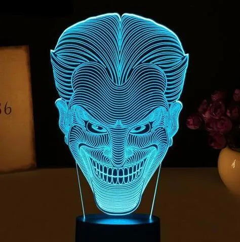 USB-powered 3D acrylic LED lamp showing colourful gradient illumination on a desk.