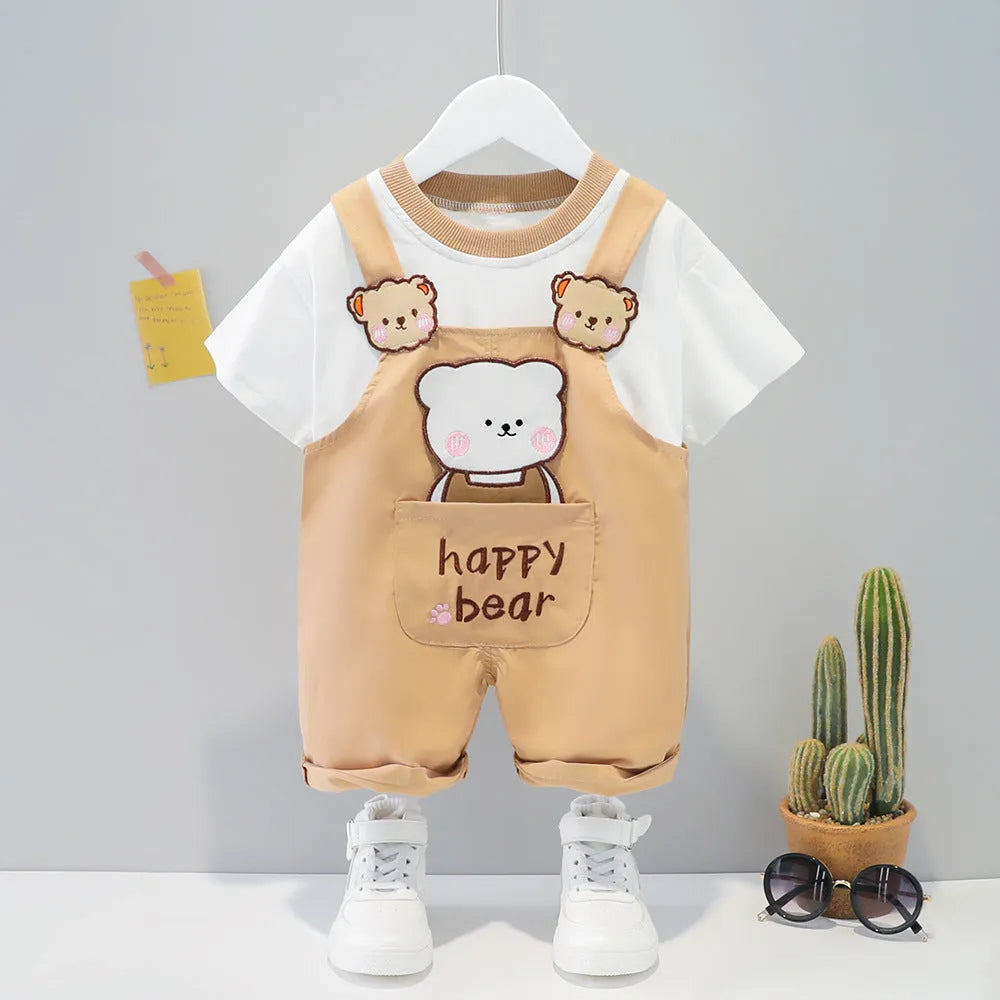Yellow cartoon short-sleeved overalls for a baby on a hanger, showing the adjustable straps.