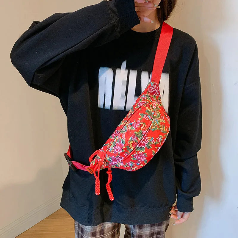 Western-style women's waist bag with large flower design and three-dimensional pockets.