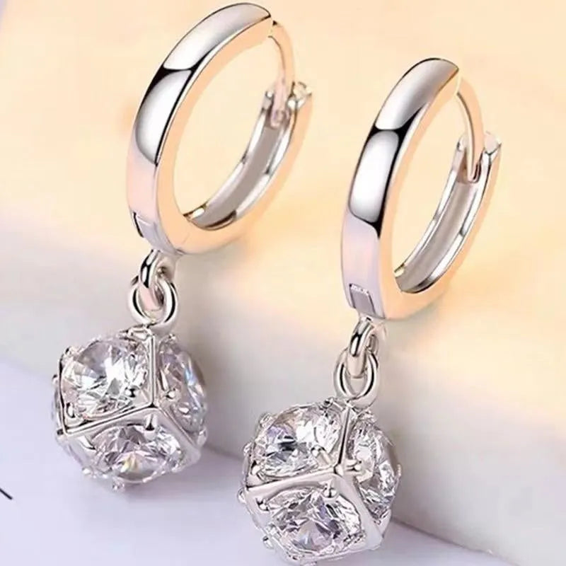 Women's copper geometric drop earrings with rose design and zircon accents in electroplated finish