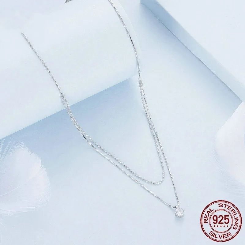 Women's sterling silver double-layer necklace with pearl chain and contemporary pendant