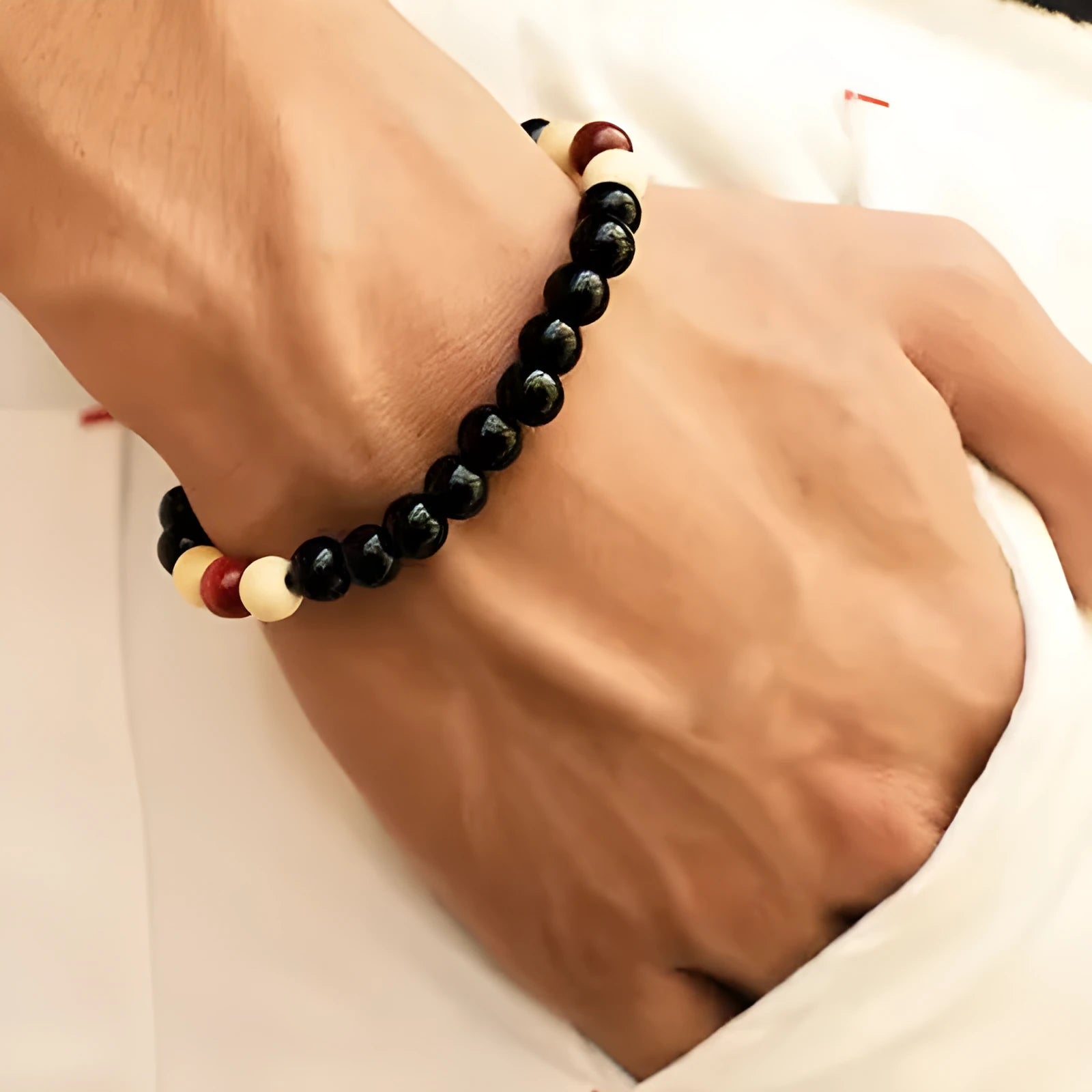Natural lava stone beaded bracelet with ethnic style on a wrist.