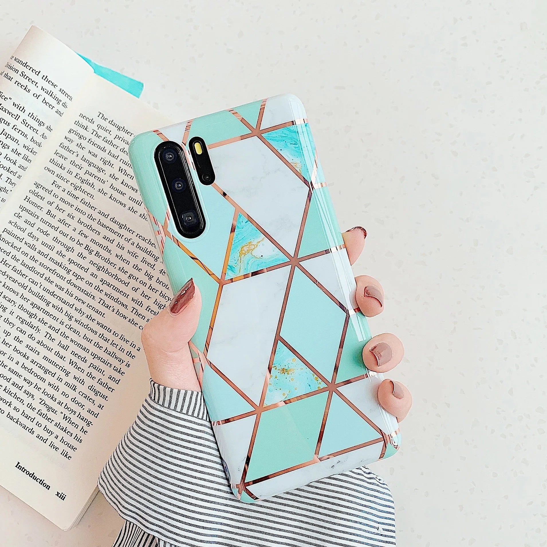 Electroplated marble pattern TPU phone case for Huawei and Samsung smartphones in various colours.