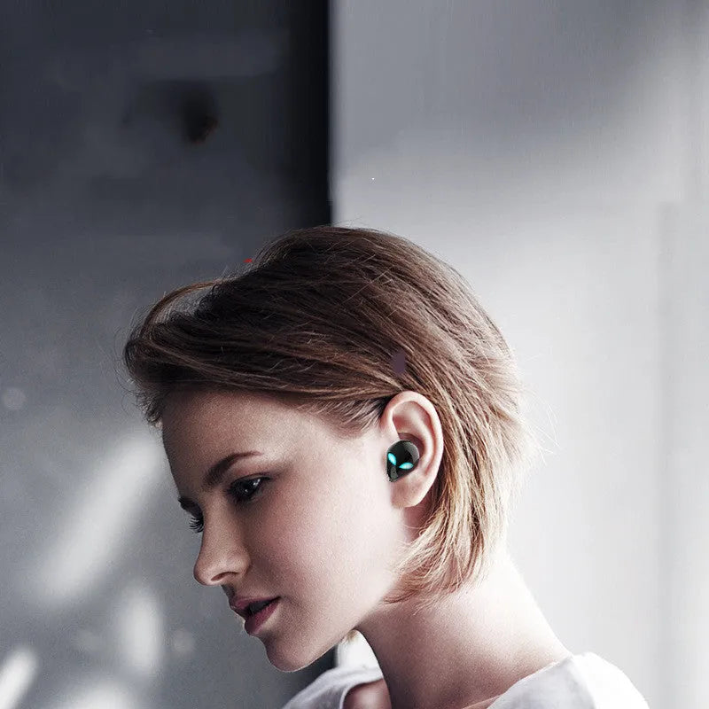 Starman T8 Alien design Bluetooth wireless earbuds with charging case showing coloured LED lighting effects