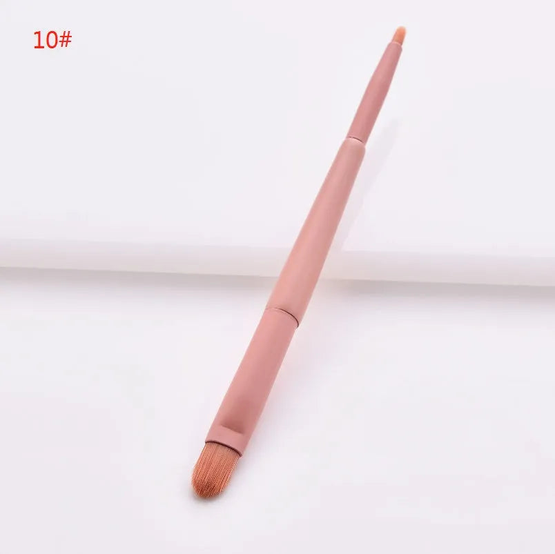 Open case showing 10 pink-handled makeup brushes including loose powder, foundation, flat head, and double-ended brushes.