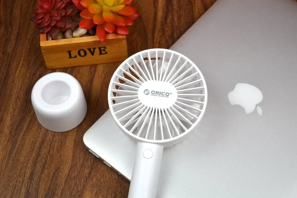 ORICO FH1 white portable USB rechargeable fan with adjustable speed settings and handheld design