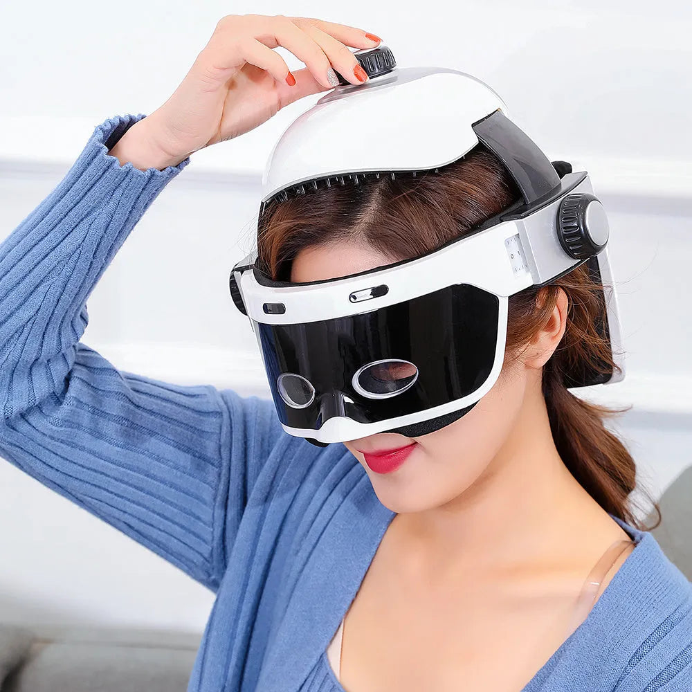 Electric eye massager in white and black with adjustable headband and LCD remote