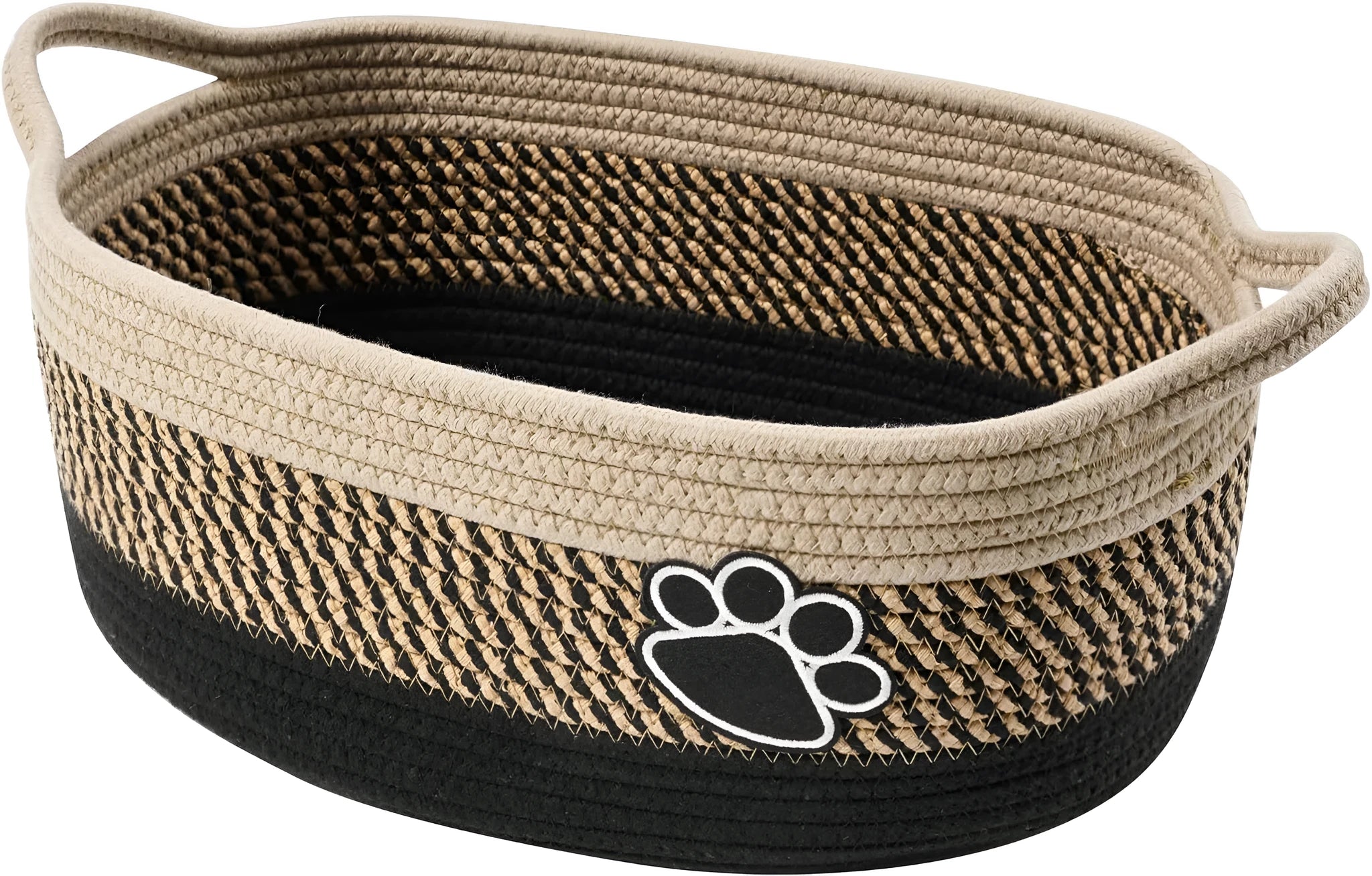 Light beige handmade woven cotton rope storage basket with handle on a wooden floor.