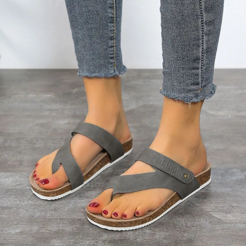 Flat toe ring flip-flops with a thick foam sole in a choice of solid colours on a white background.