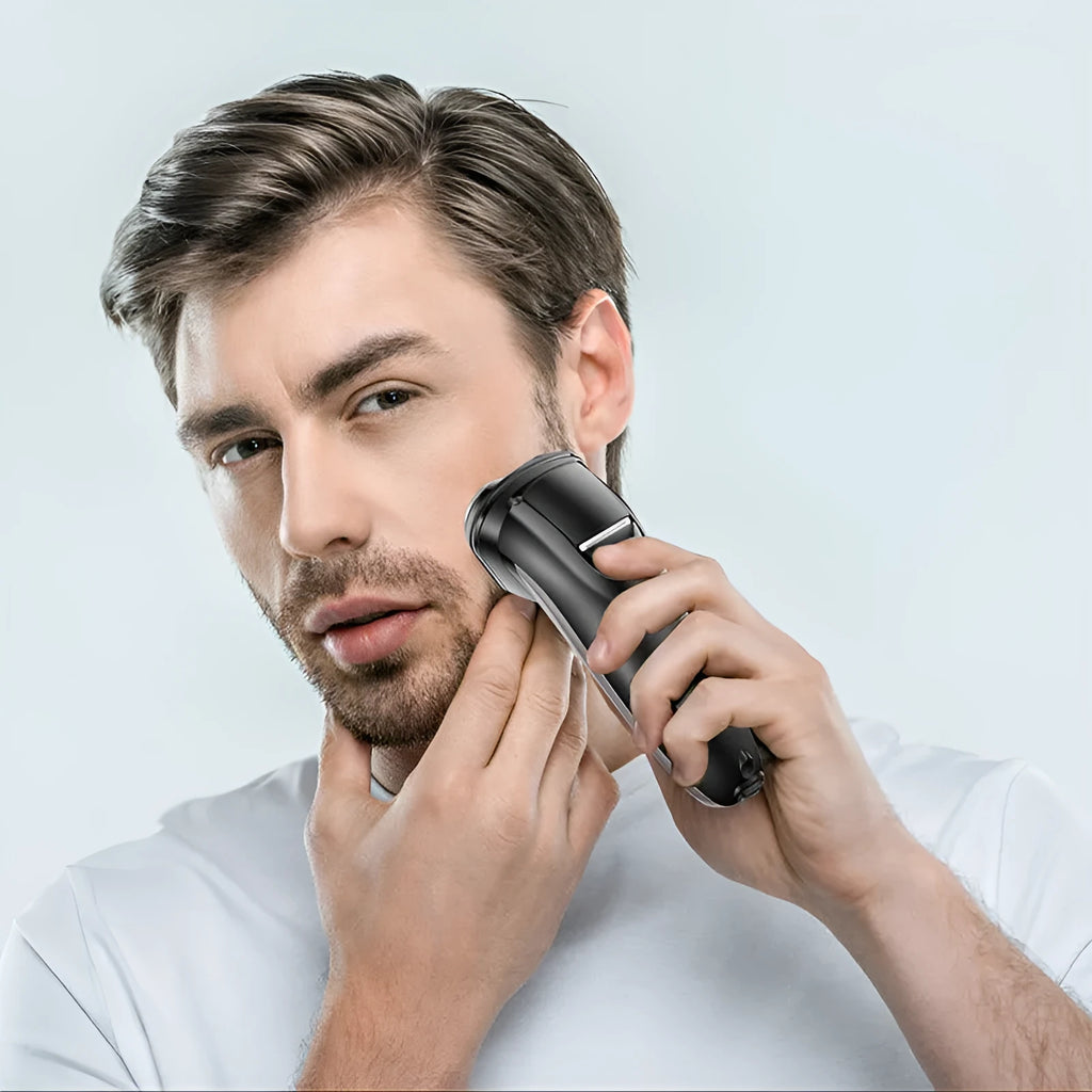 Men's electric shaver kit with three floating heads, pop-up trimmer, USB cable, cleaning brush and storage bag.