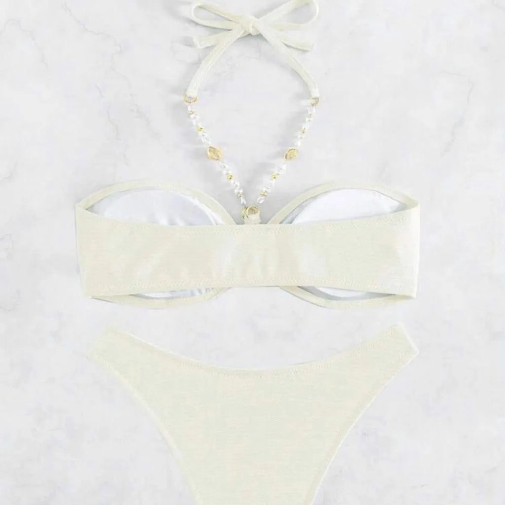 Women's solid colour halter neck bikini set on a white background, shown in creamy-white.