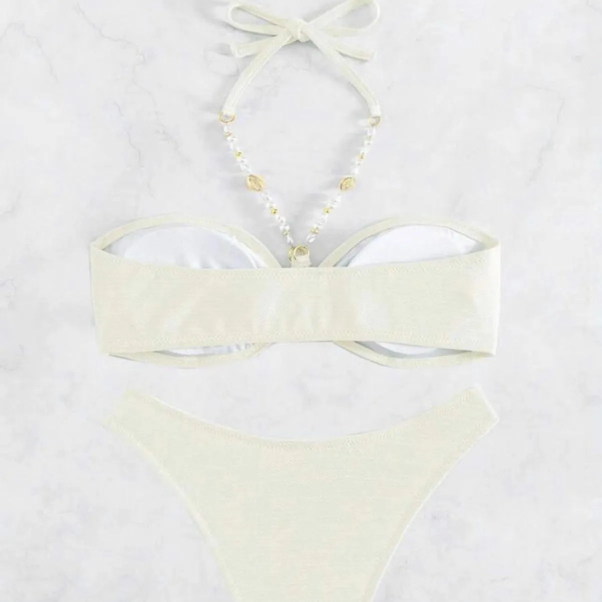 Women's solid colour halter neck bikini set on a white background, shown in creamy-white.