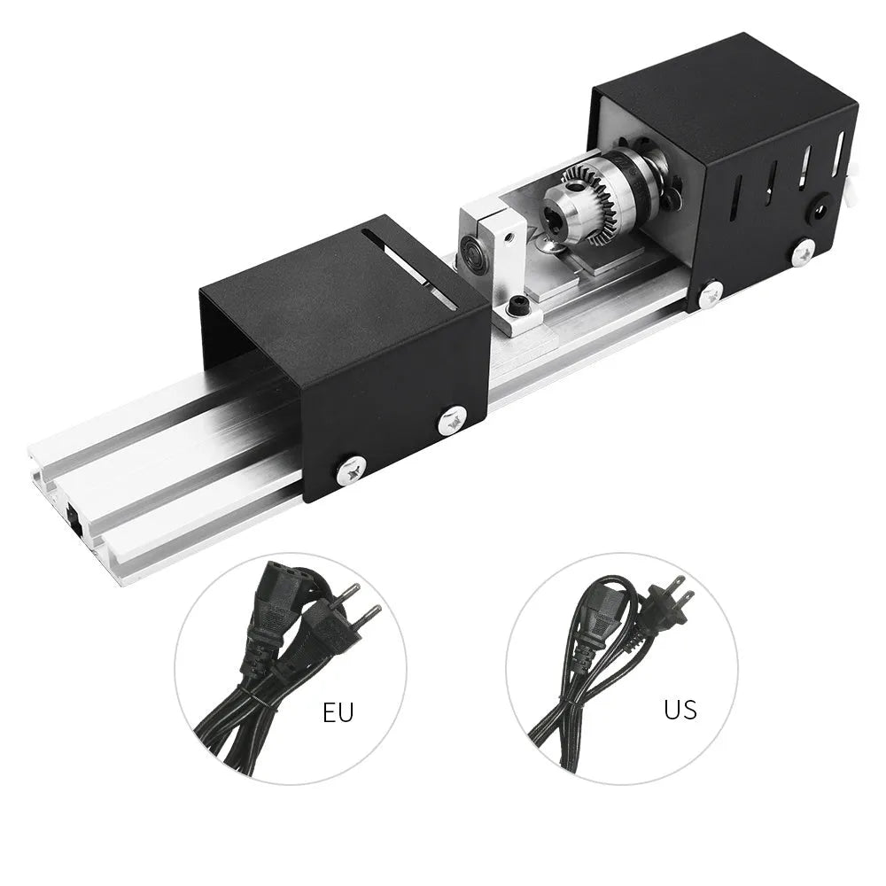 Compact silver metal mini manual woodworking lathe with carving knives on a benchtop