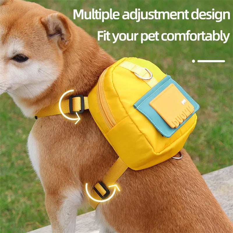Blue adjustable dog harness with integrated backpack and attached tow rope on a medium-sized dog