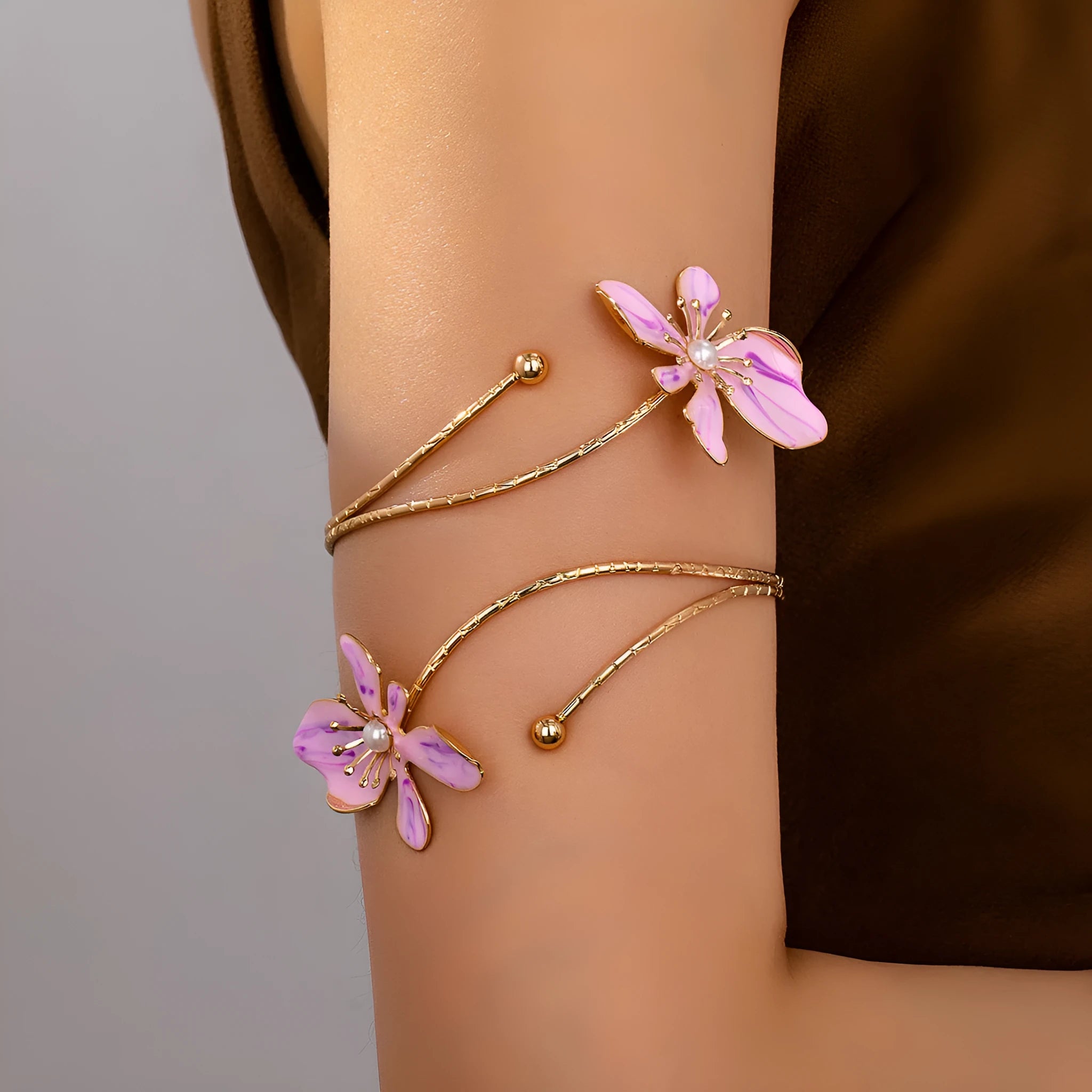 Alloy hollow armband bracelet with pattern lines shown in pink and purple colour options