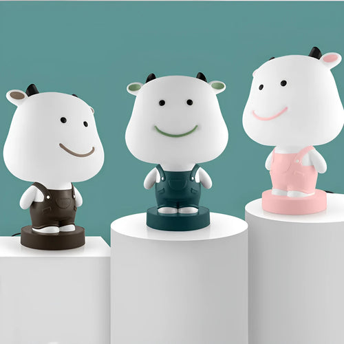 Cartoon animal table lamp with LED lighting and plastic shade in random bear, cattle, rabbit, or tiger designs