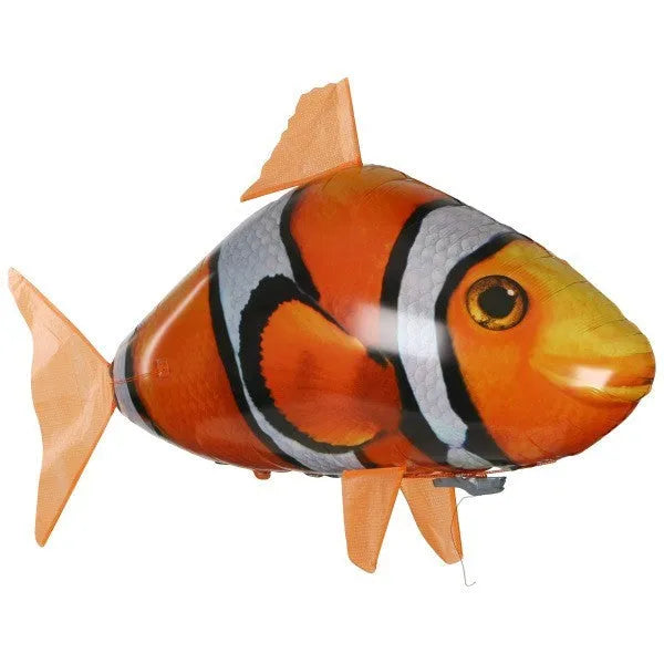 Large remote control shark-shaped helium balloon toy floating indoors with a remote.