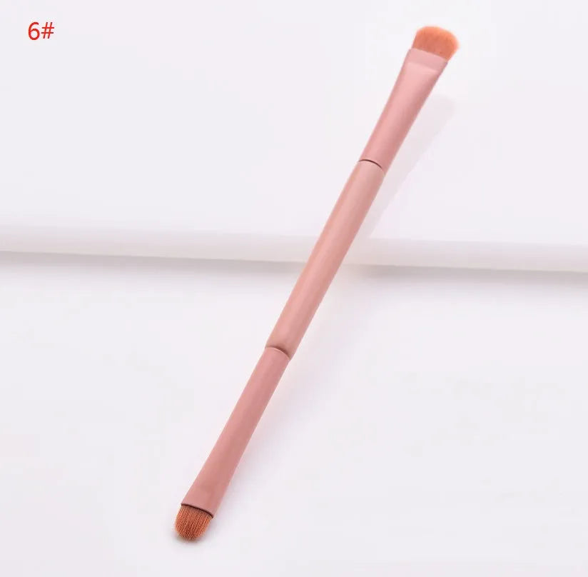 Open case showing 10 pink-handled makeup brushes including loose powder, foundation, flat head, and double-ended brushes.