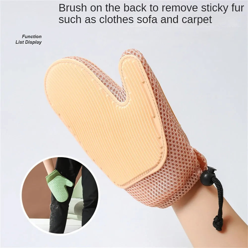 Dark blue pet hair removal grooming glove for right hand on a fabric sofa.