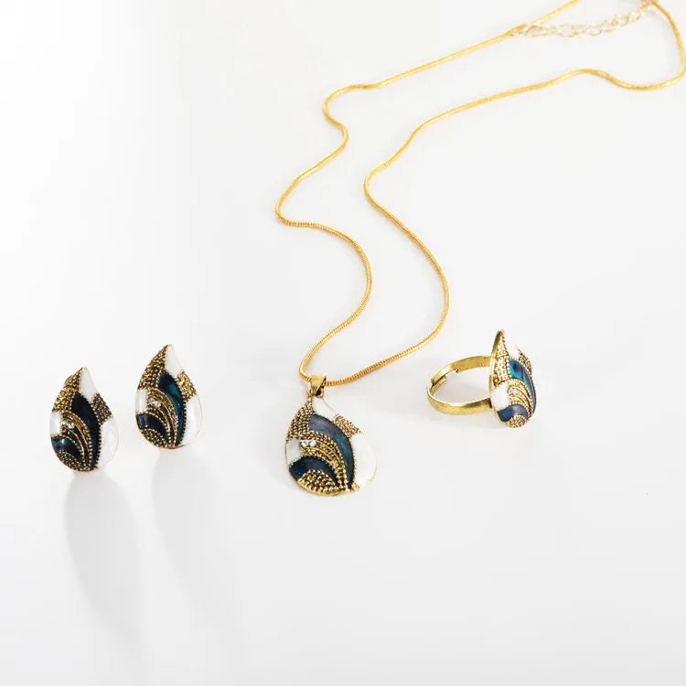 Water drop jewelry set including necklace, earrings and ring in gold or silver zinc alloy finish.