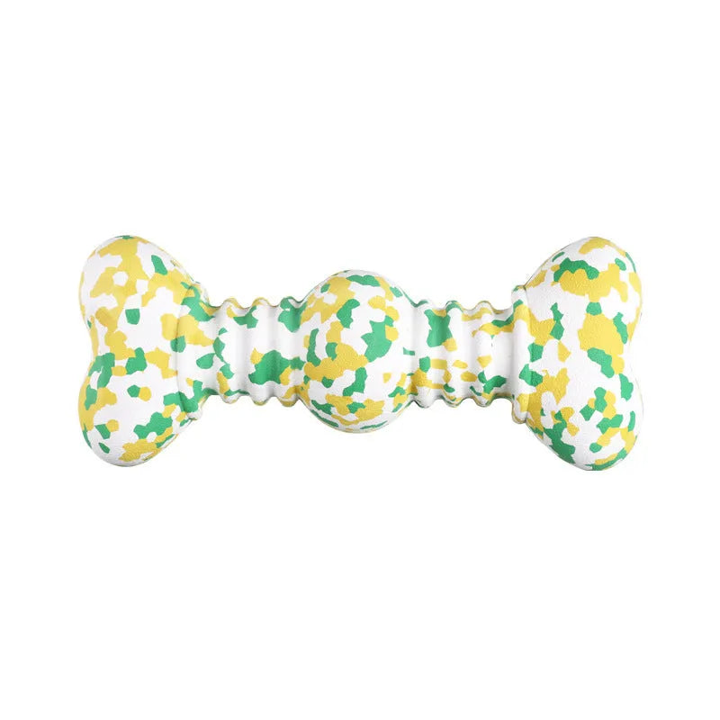 Green, white, and yellow camouflaged natural rubber bone chew toy for large dogs on a plain background.