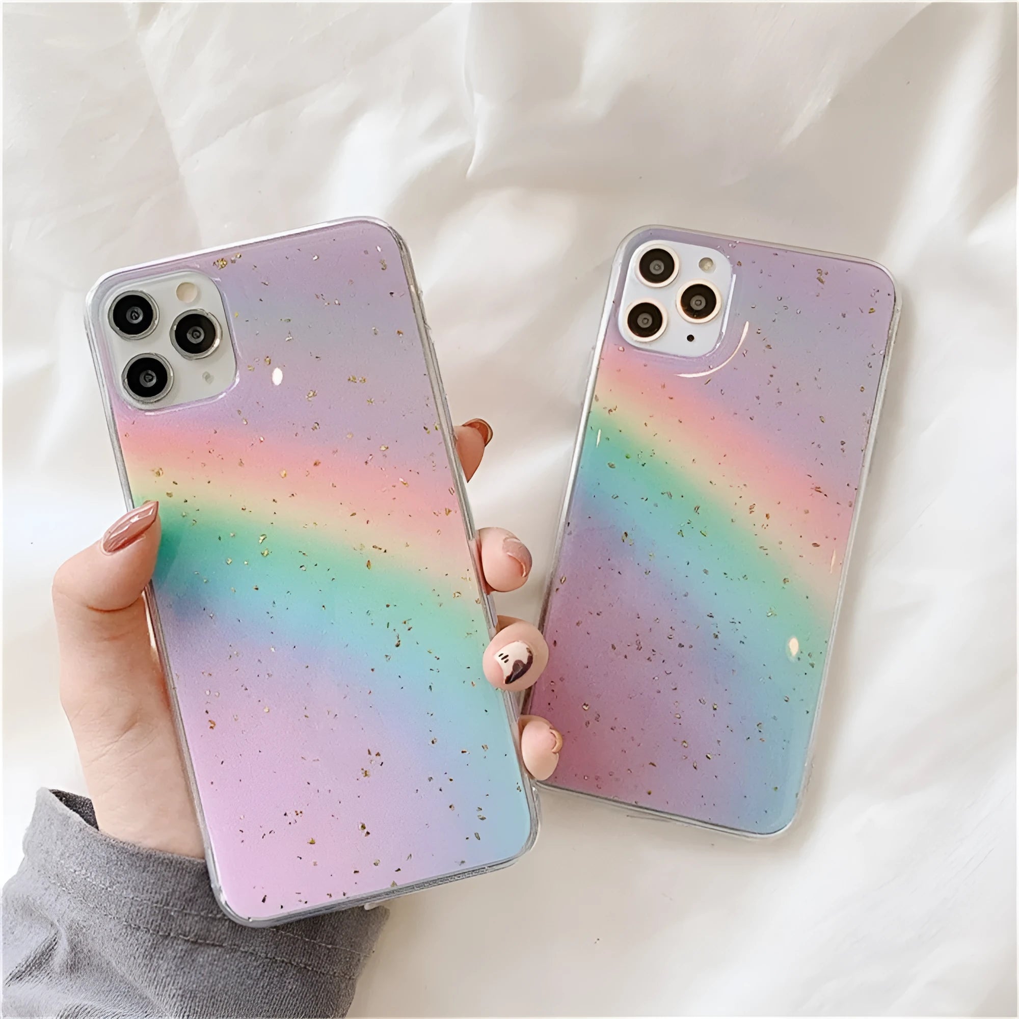 Rainbow gradient iPhone case with striped design for various models.