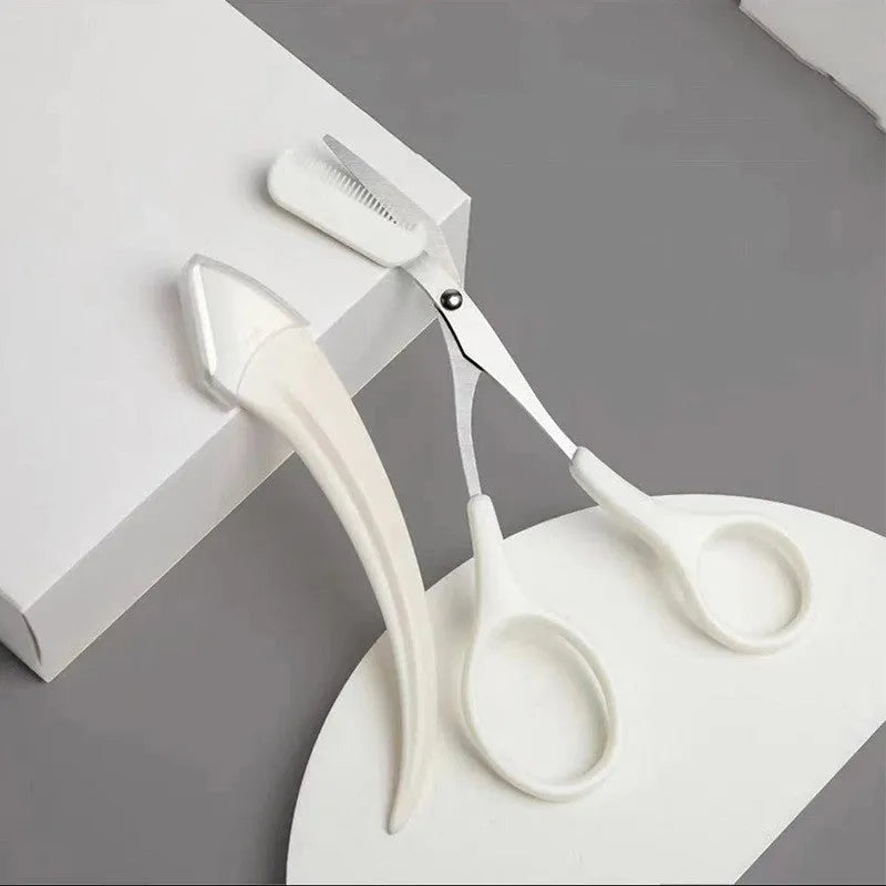 White and pink curved moon-shaped eyebrow trimming knife with a comb on a white background.