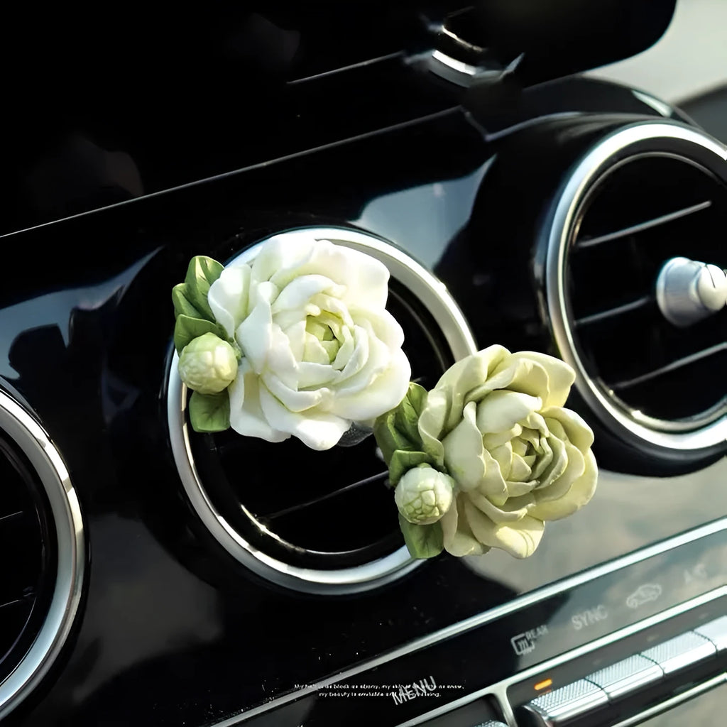 Solid gypsum car vent air freshener in jasmine fragrance, showing off-white or green colour.