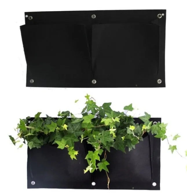 Vertical wall garden planting bag with multiple pockets for herbs and flowers hanging on fence