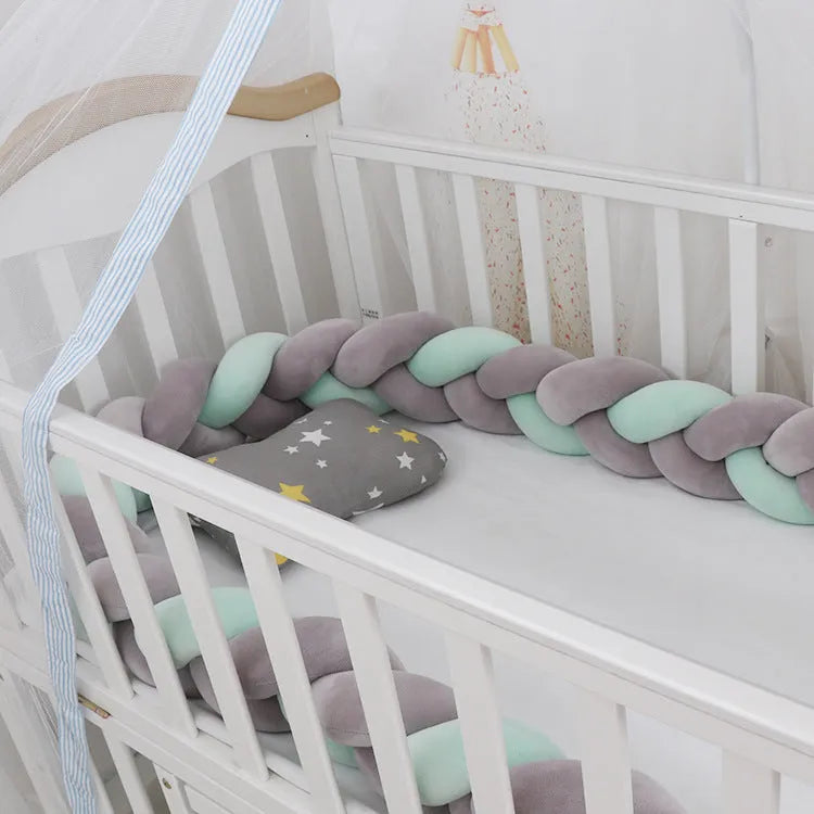 Baby crib bumper braid knot pillow cushion in spandex velvet, shown in a light grey colour