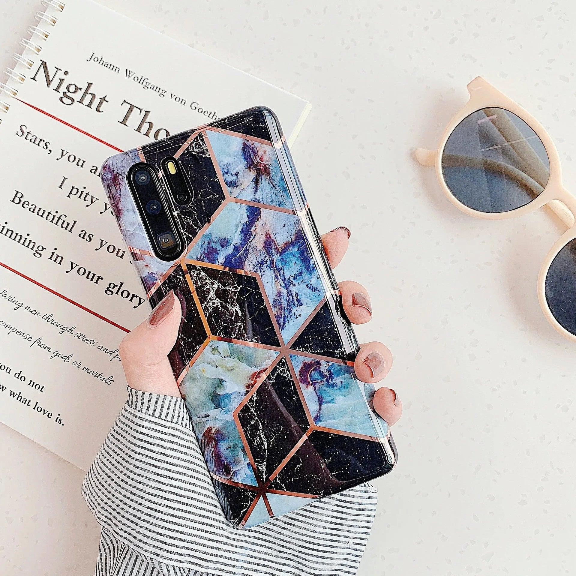 Electroplated marble pattern TPU phone case for Huawei and Samsung smartphones in various colours.