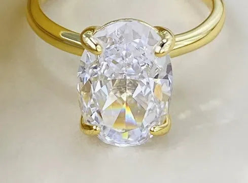 Oval women's ring with four-claw setting in 9 silver, gold and silver colour options