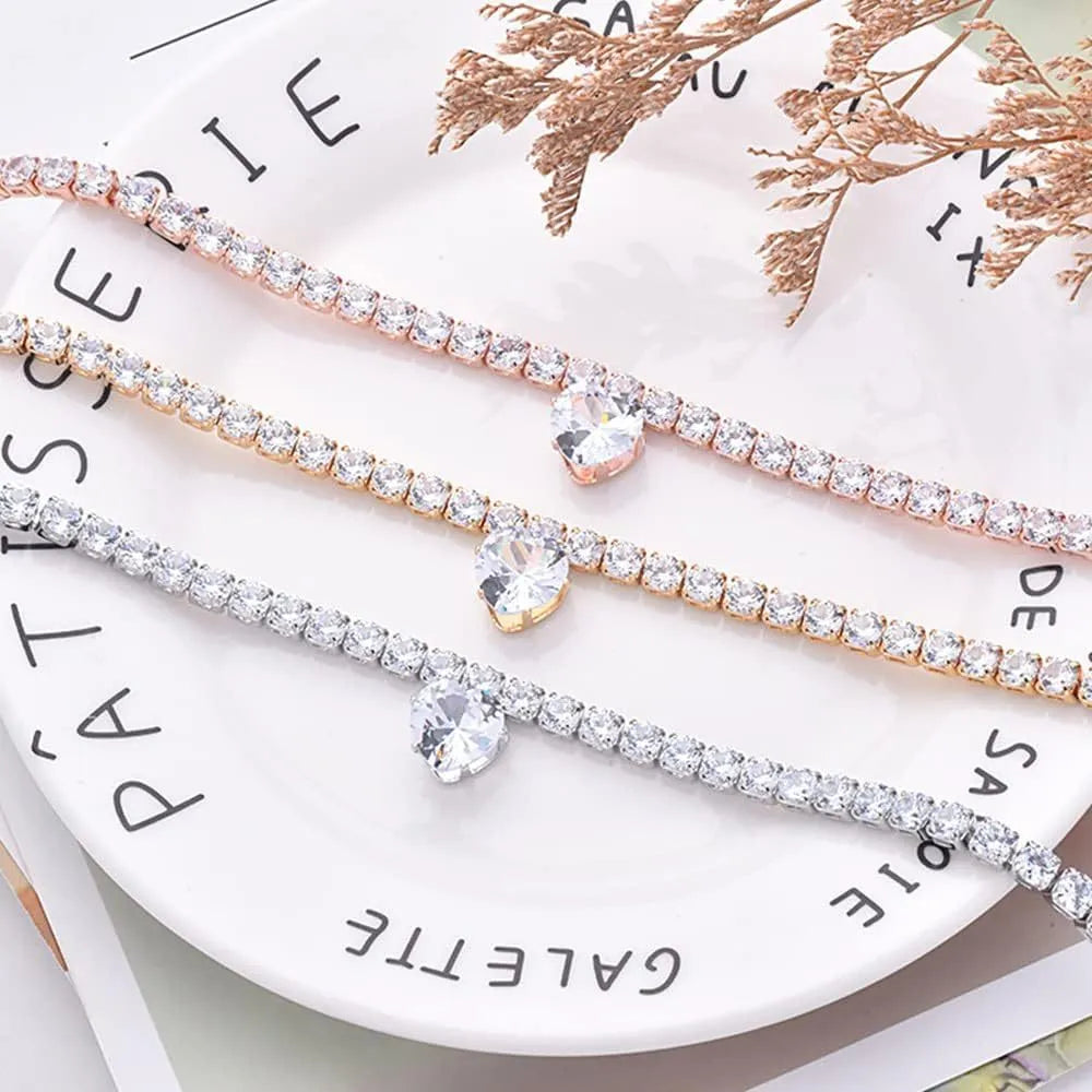 Gold rhinestone heart-shaped decorative collar for a dog with an extension chain.
