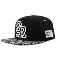 Cotton baseball cap with adjustable strap in black and white colour options