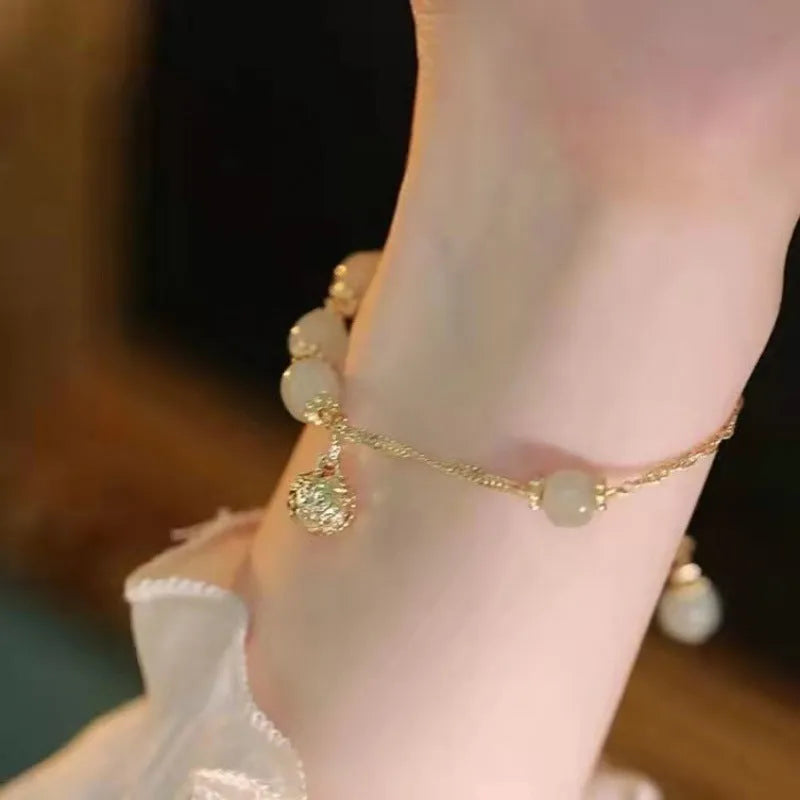 Chinese style bamboo leaf glass bracelet for women with a bamboo joint design.